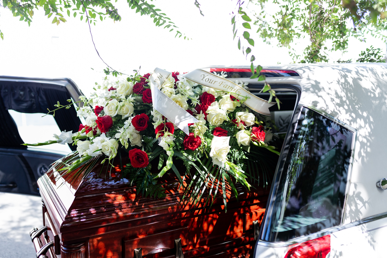 coffin with flowers on